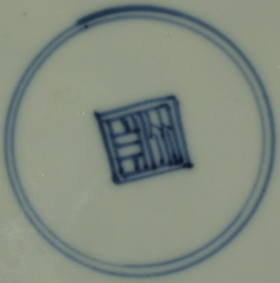 2010151 Square shop mark in a double circle, underglaze blue.